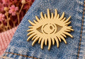 Broche oeil soleil dorée