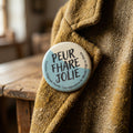 Badge rond PEUR FHARE JOLIE — badge seul